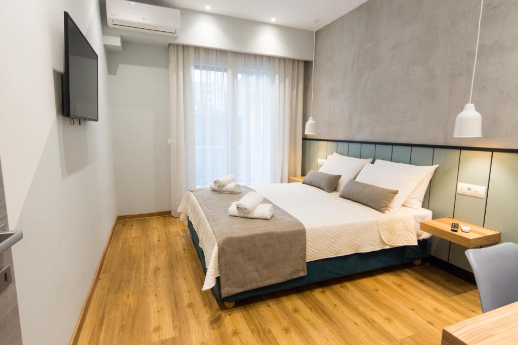 Posteľ alebo postele v izbe v ubytovaní Pleasant Stay
