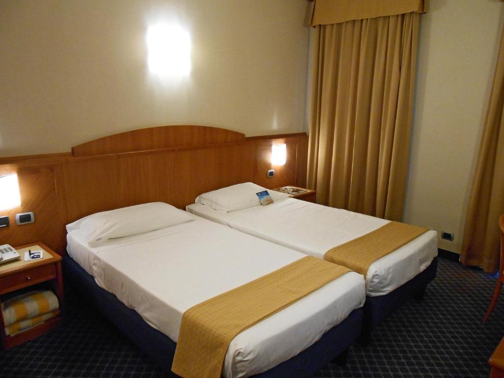 Postel nebo postele na pokoji v ubytování Hotel Sportsman