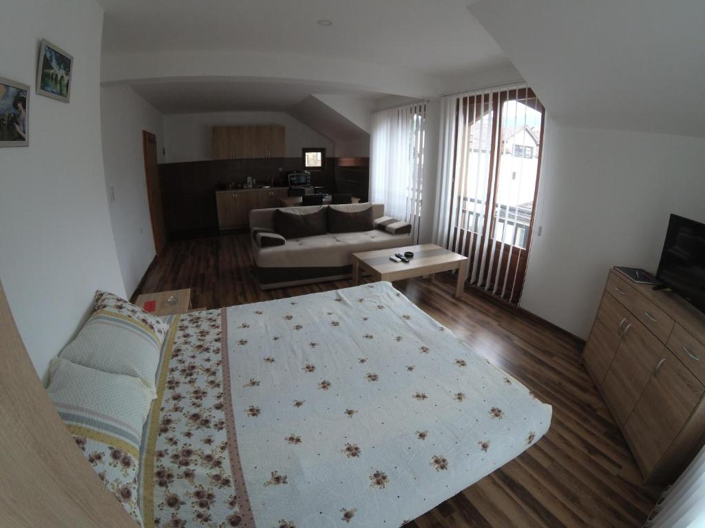 Postel nebo postele na pokoji v ubytování Apartment and rooms Konak