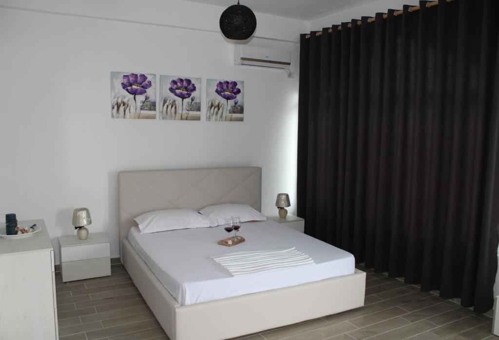 Postel nebo postele na pokoji v ubytování HC Hotel & Suites
