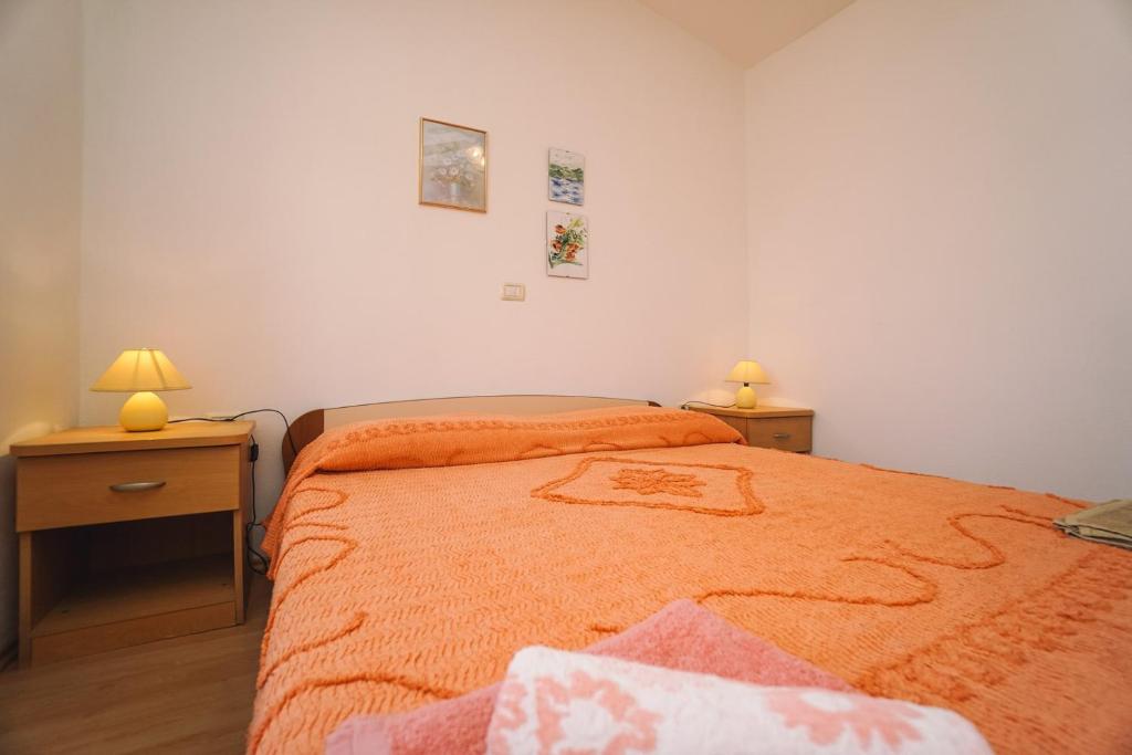 Postel nebo postele na pokoji v ubytování Apartment Sandra