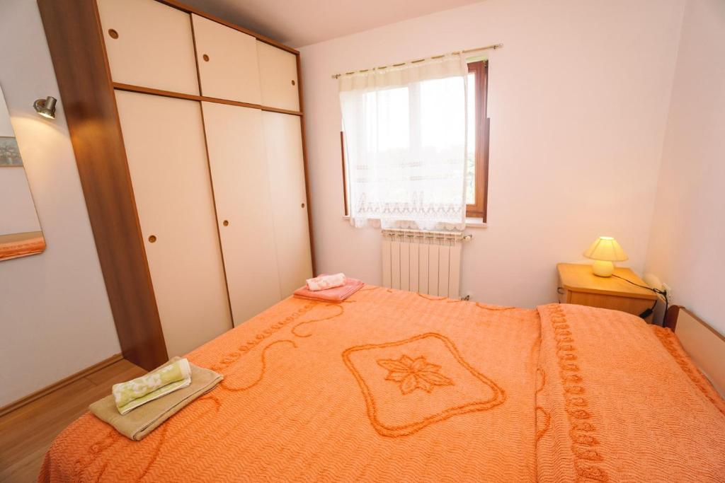 Postel nebo postele na pokoji v ubytování Apartment Sandra