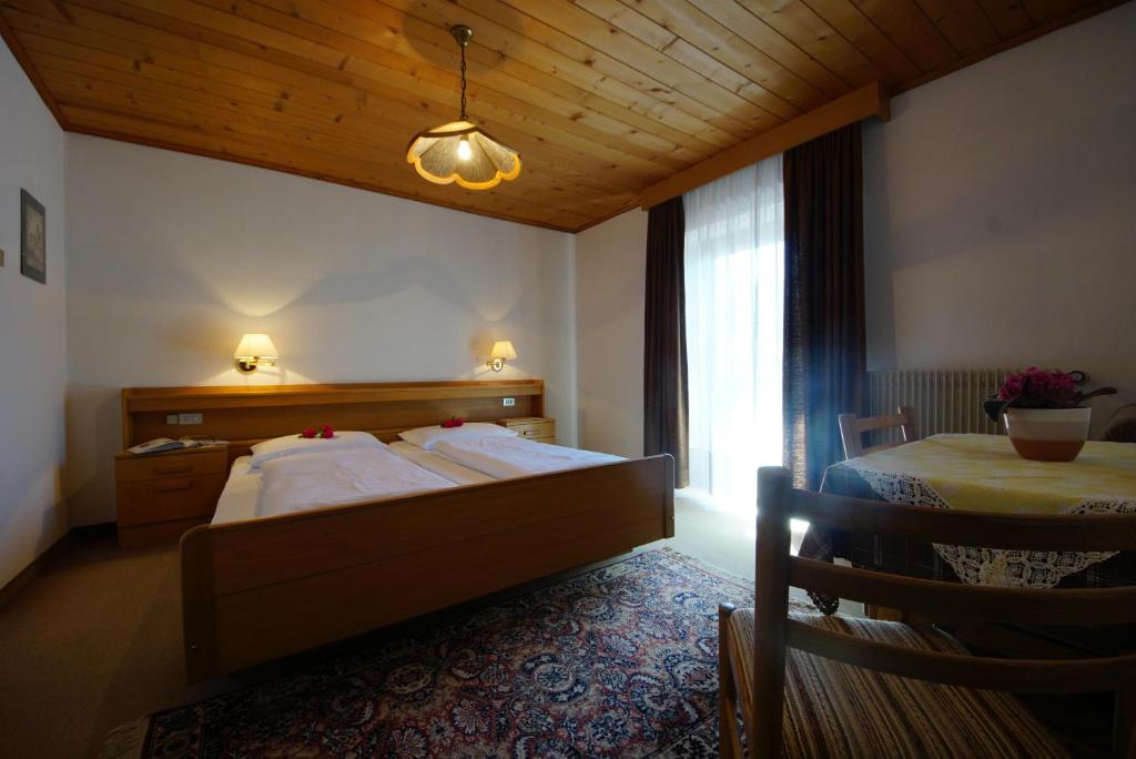 Postel nebo postele na pokoji v ubytování Garni Flurida