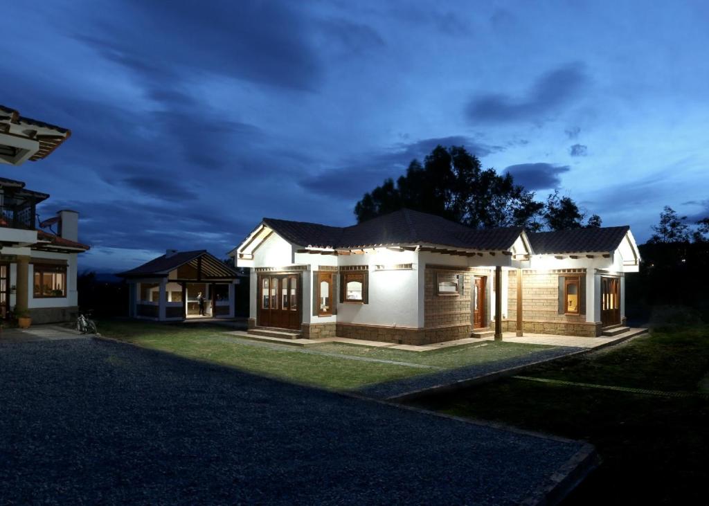a house lit up at night at Chalet Privado in Villa de Leyva