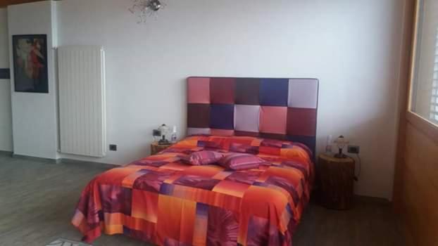 Postel nebo postele na pokoji v ubytování Agriturismo Alveare sul lago