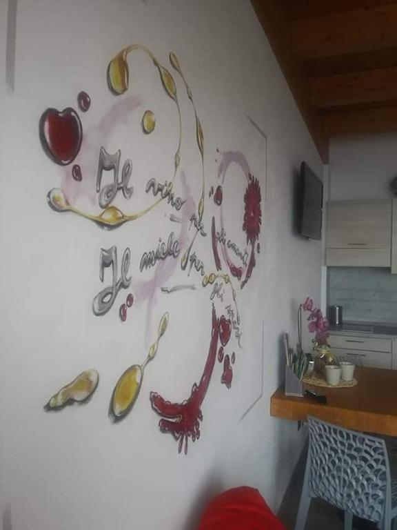 TV a/nebo společenská místnost v ubytování Agriturismo Alveare sul lago