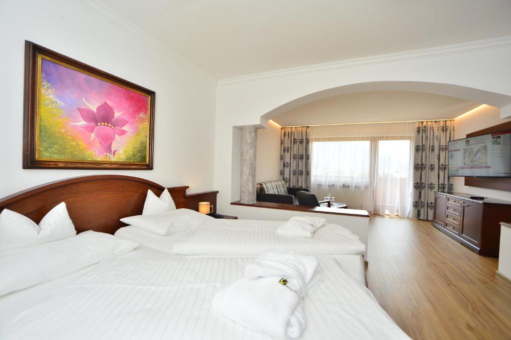 Postel nebo postele na pokoji v ubytování Hotel Residenz Hochland
