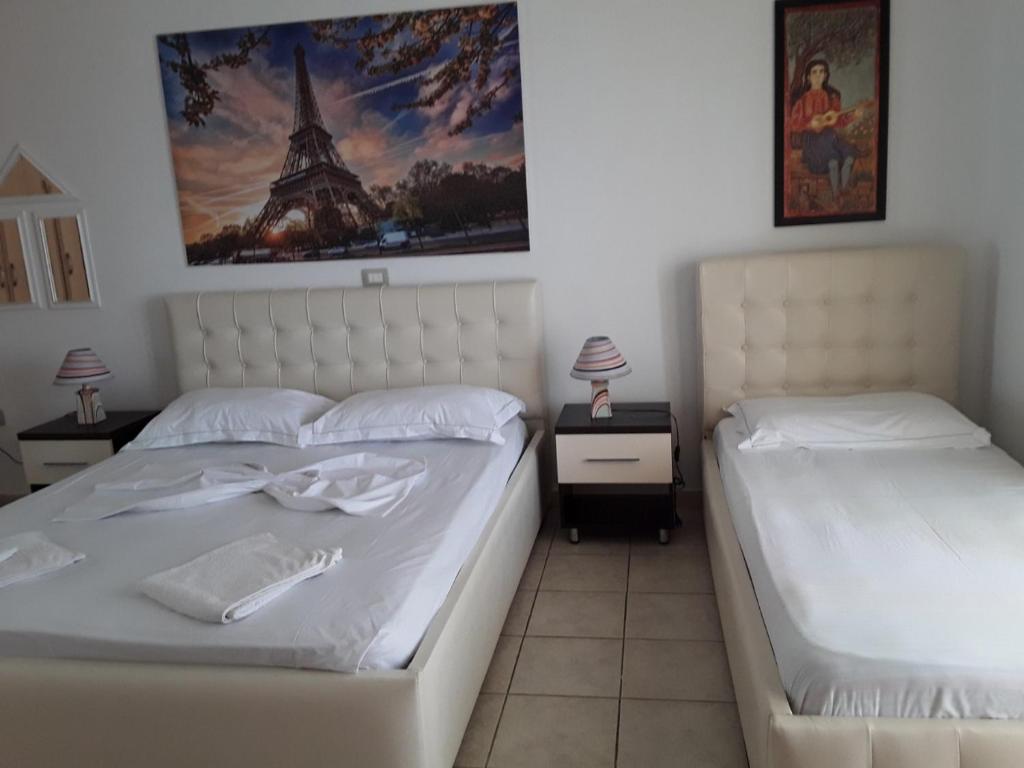 Postel nebo postele na pokoji v ubytování Hotel Odhisea Qeparo