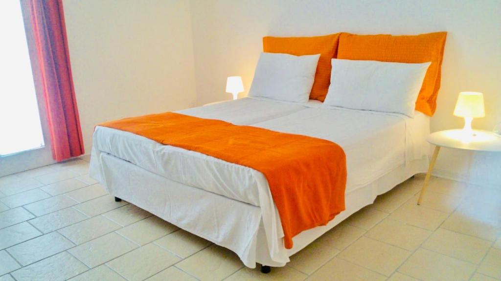 מיטה או מיטות בחדר ב-RESIDENZA ISABELLA rooms and apartments