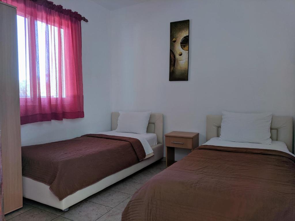 Postel nebo postele na pokoji v ubytování Beni Bungalows