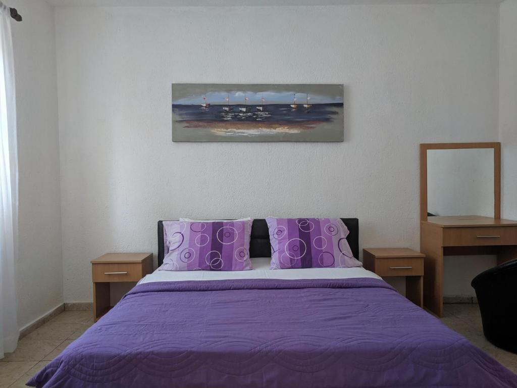 Postel nebo postele na pokoji v ubytování Beni Bungalows