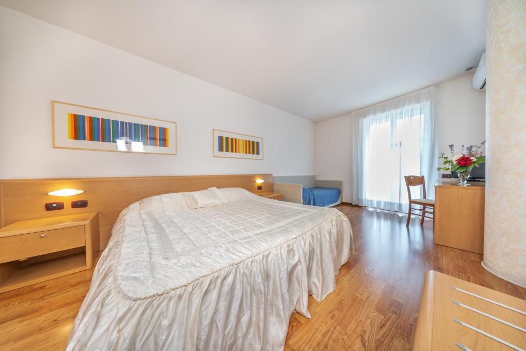 Postel nebo postele na pokoji v ubytování Hotel Karinhall