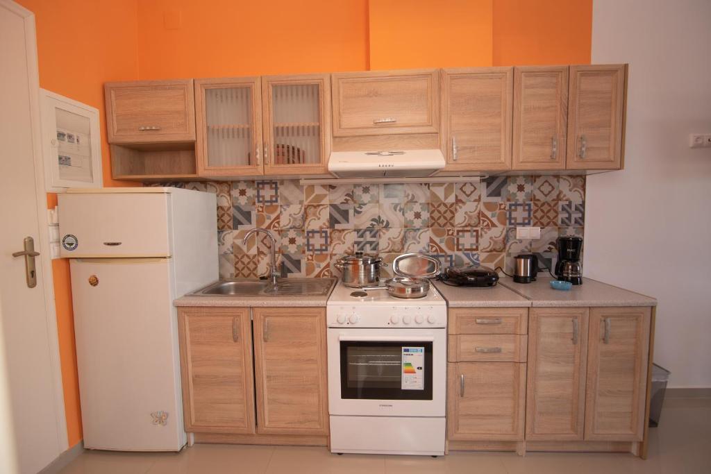 Kuchyň nebo kuchyňský kout v ubytování Calypso Apartments
