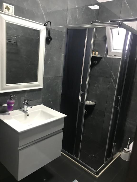 Koupelna v ubytování Hotel Floga