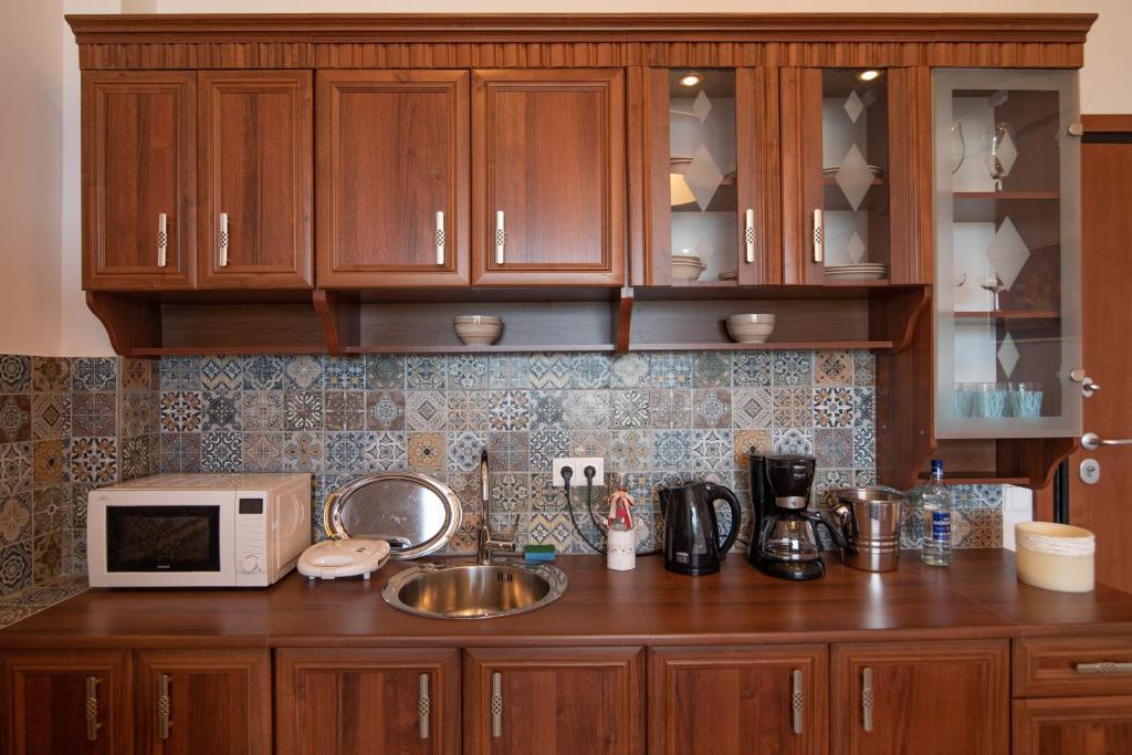 Kuchyň nebo kuchyňský kout v ubytování Calypso Apartments