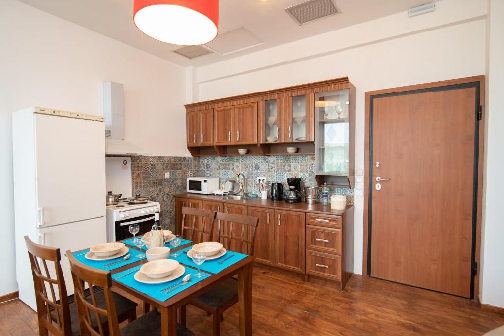 Kuchyň nebo kuchyňský kout v ubytování Calypso Apartments