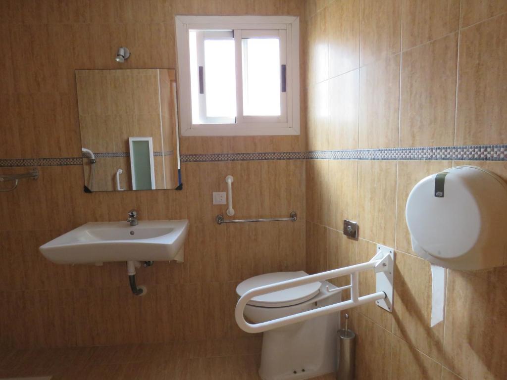 Koupelna v ubytování Hotel Alain