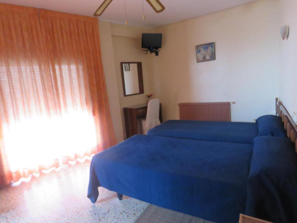 Postel nebo postele na pokoji v ubytování Hotel Alain