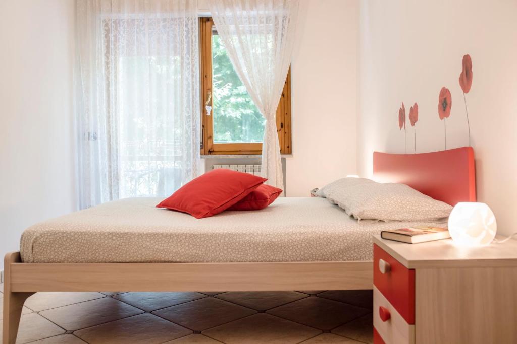 a bedroom with a bed and a window at Pretty House Sorrento in Piano di Sorrento