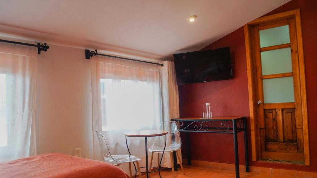 Postel nebo postele na pokoji v ubytování Hotel Casa Margarita