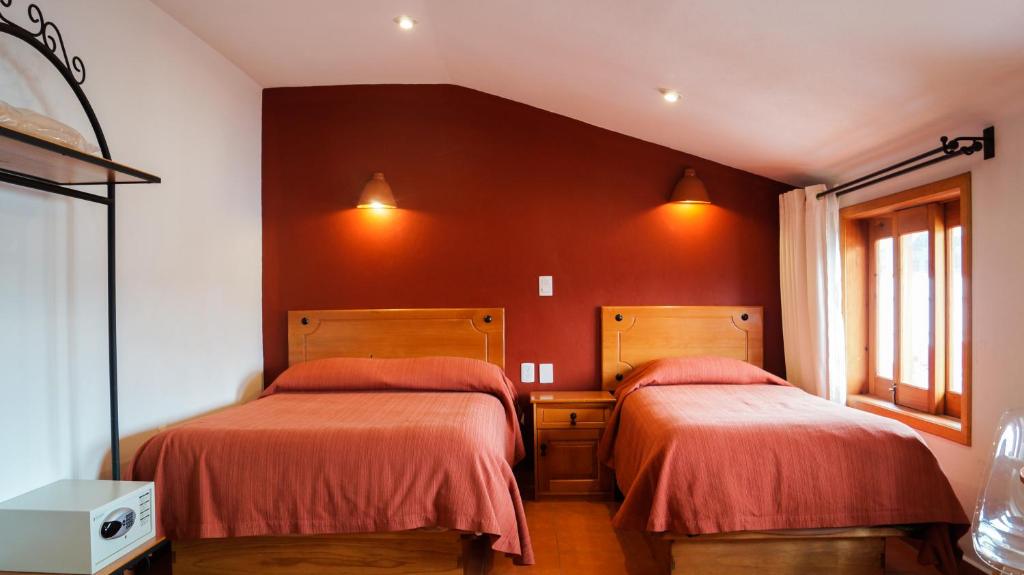Postel nebo postele na pokoji v ubytování Hotel Casa Margarita