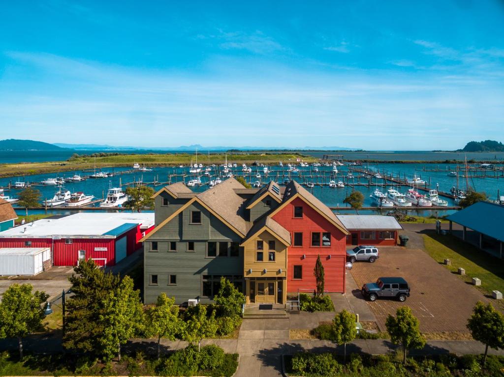 a group of houses in a harbor with a marina at At The Helm Hotel in Ilwaco