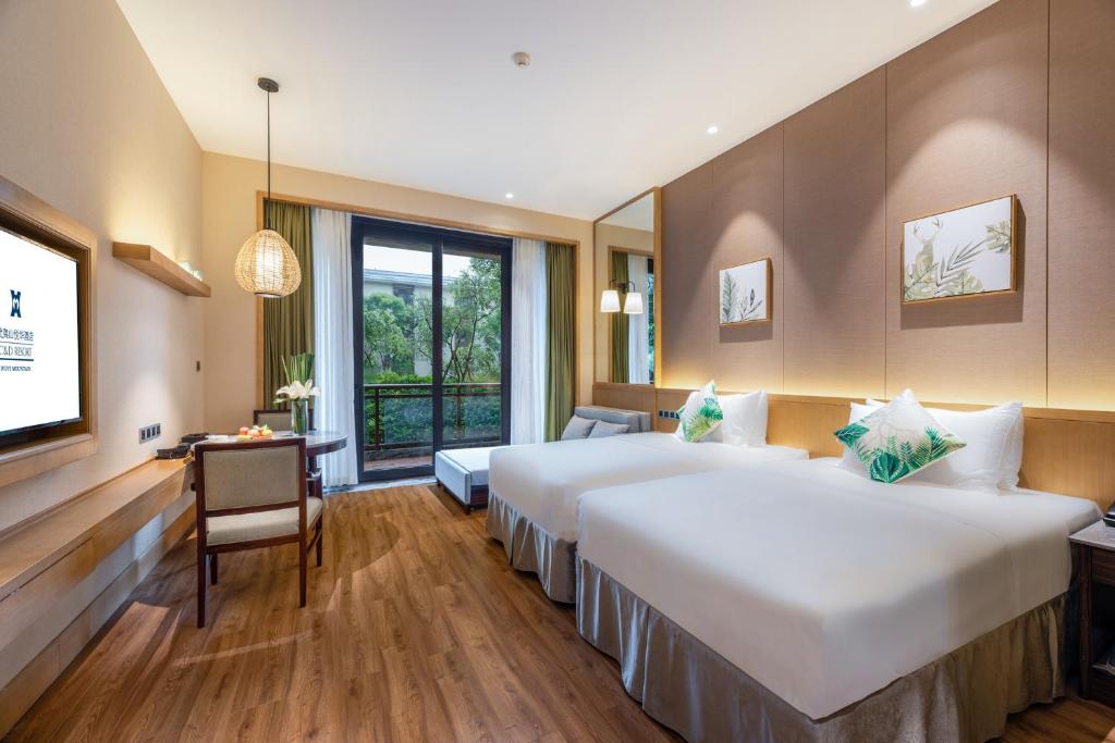 Postel nebo postele na pokoji v ubytování C&D Resort,Wuyi Mountain