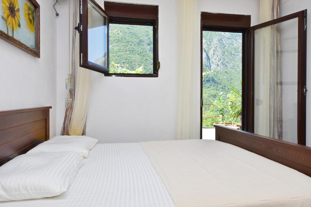Postel nebo postele na pokoji v ubytování Rooms Sveti Toma