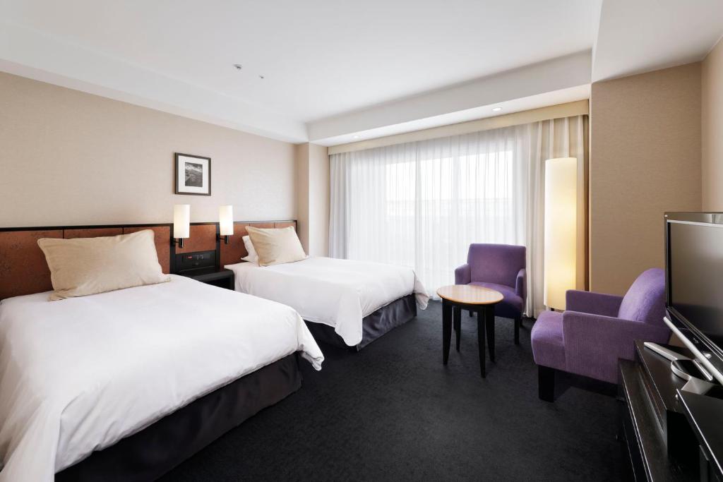 Postel nebo postele na pokoji v ubytování Hotel Granvia Kyoto
