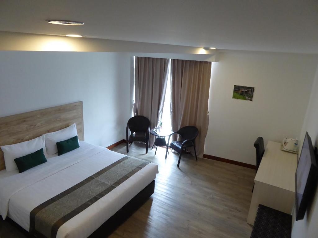 Postel nebo postele na pokoji v ubytování Molek Garden Hotel