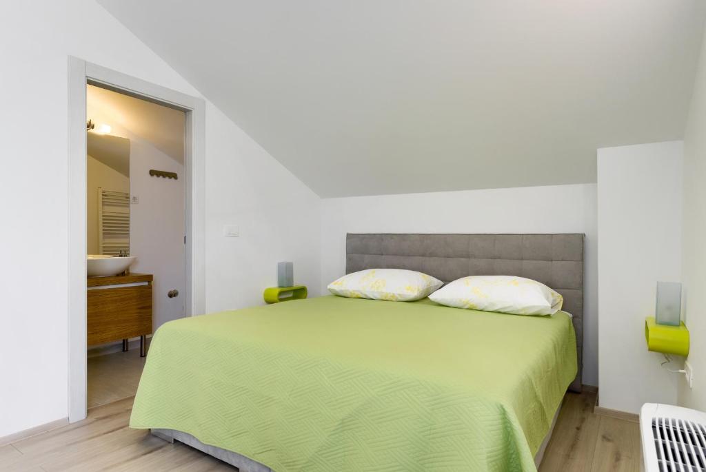 Posteľ alebo postele v izbe v ubytovaní Apartmani Bosa