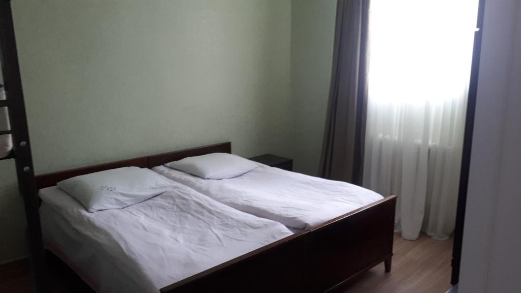 Postel nebo postele na pokoji v ubytování Blue Guesthouse