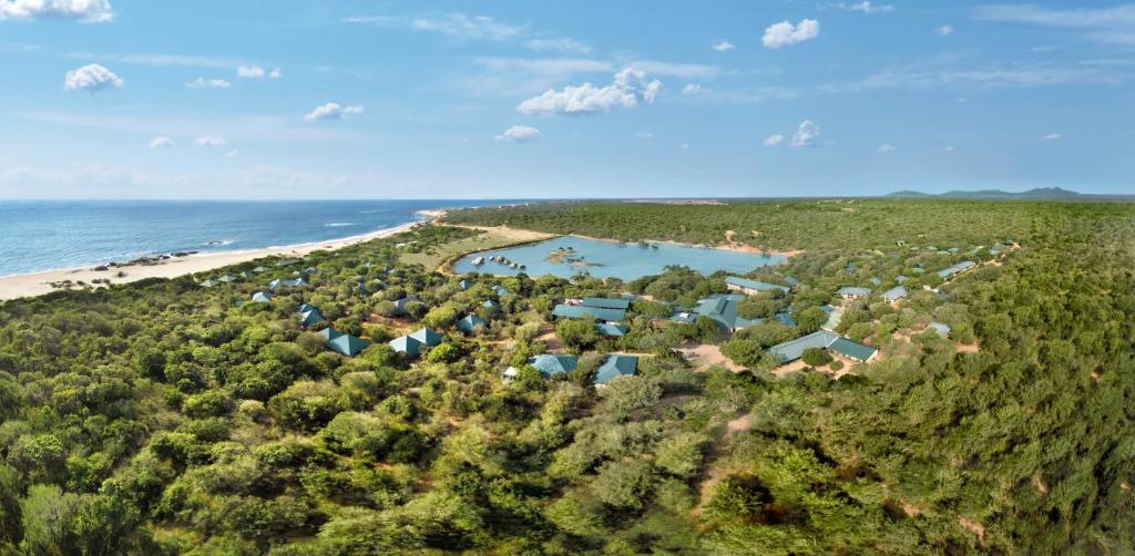 an aerial view of a beach and houses at Cinnamon Wild Yala in Yala