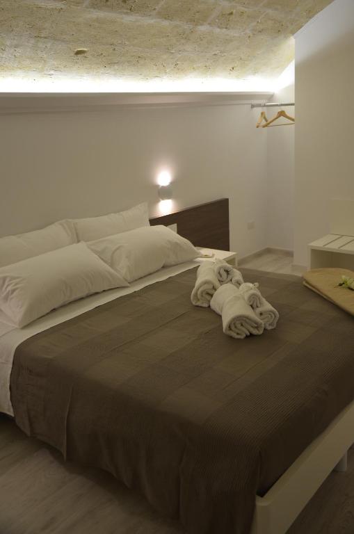 Postel nebo postele na pokoji v ubytování In & Out Matera