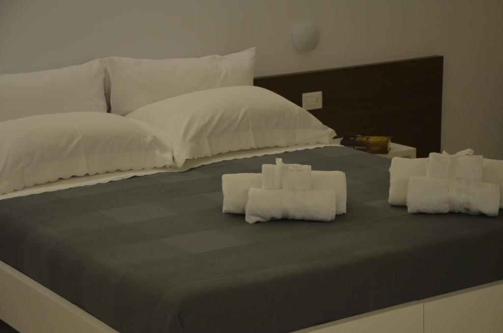 Postel nebo postele na pokoji v ubytování In & Out Matera