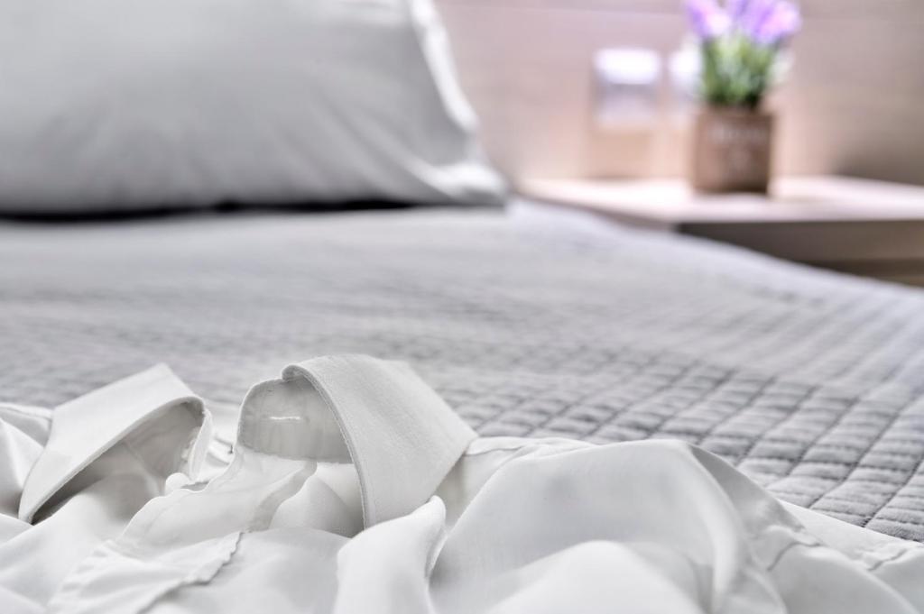 Postel nebo postele na pokoji v ubytování Halaris Rooms