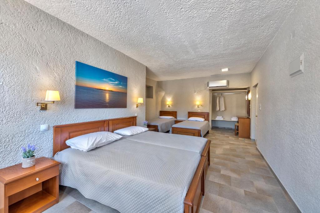 Postel nebo postele na pokoji v ubytování Halaris Rooms
