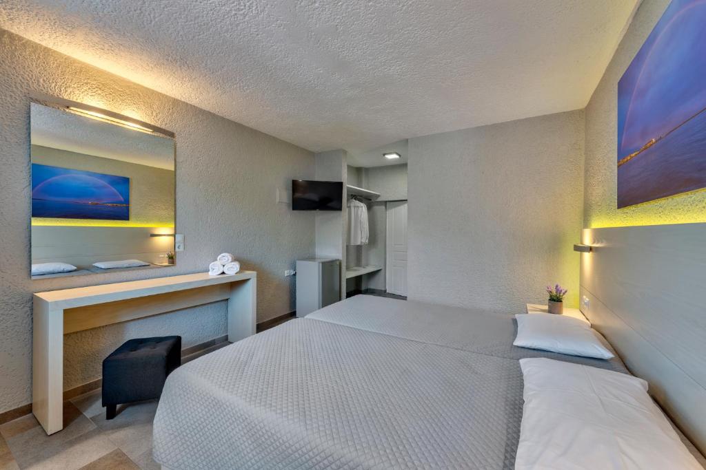 Postel nebo postele na pokoji v ubytování Halaris Rooms