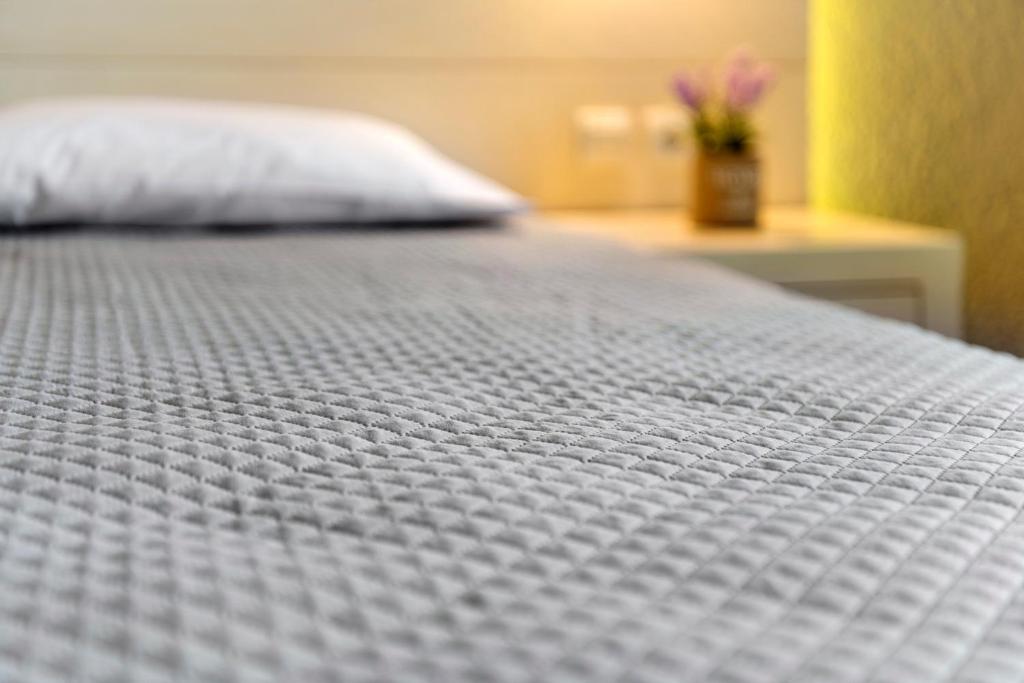 Postel nebo postele na pokoji v ubytování Halaris Rooms
