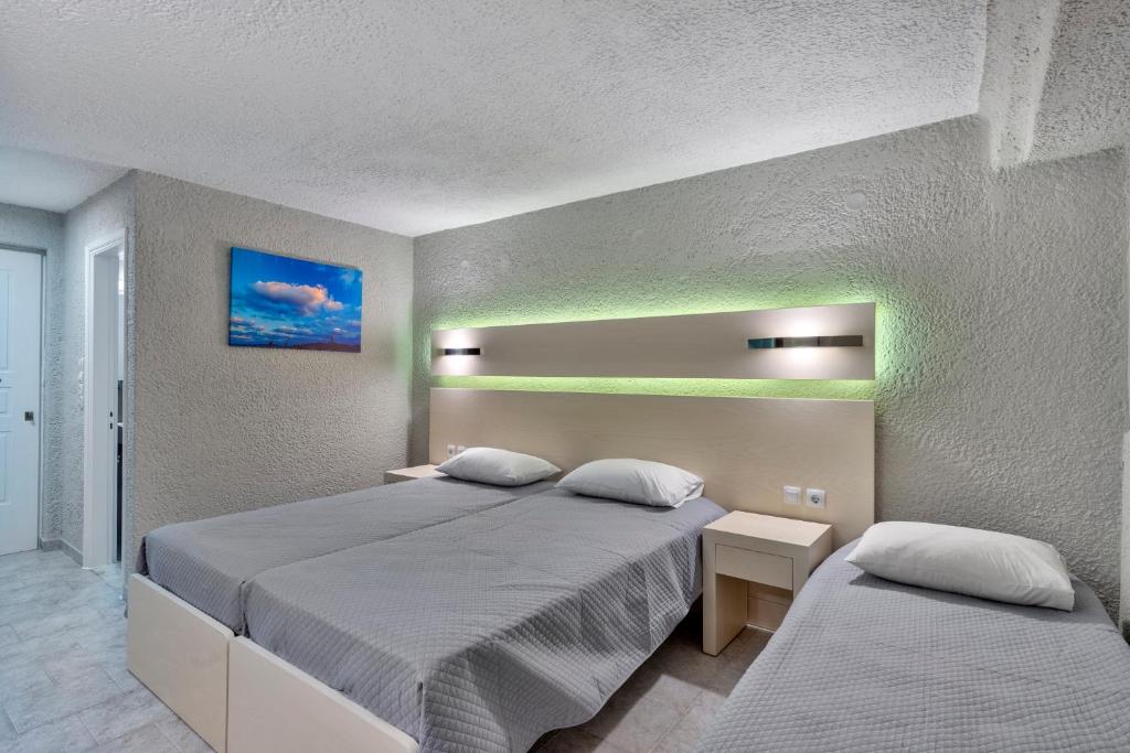 Postel nebo postele na pokoji v ubytování Halaris Rooms