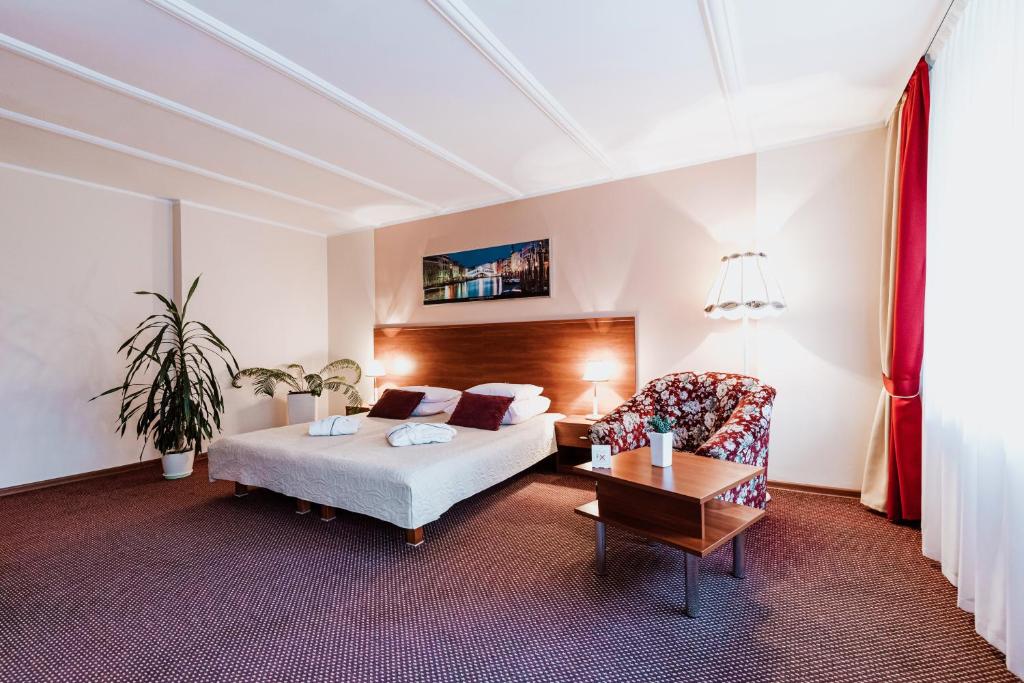 Posteľ alebo postele v izbe v ubytovaní Hotel Gromada Medical SPA Busko Zdrój