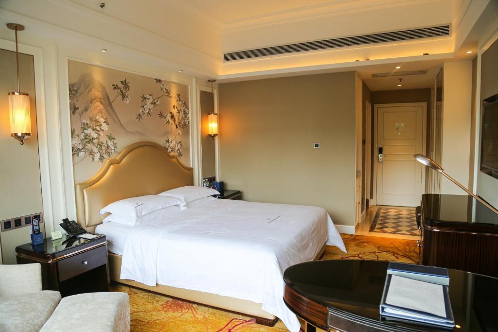 Postel nebo postele na pokoji v ubytování Shenzhen Dayhello international Hotel (Baoan)