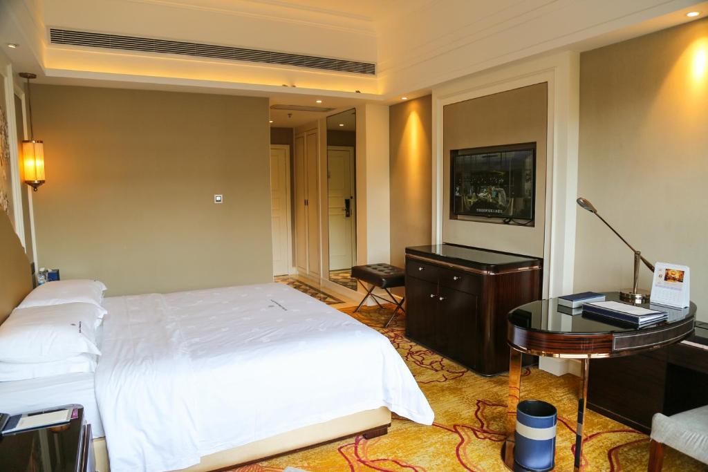 Postel nebo postele na pokoji v ubytování Shenzhen Dayhello international Hotel (Baoan)