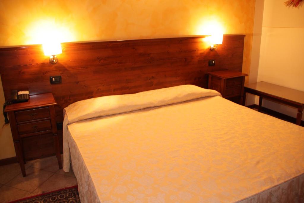 Postel nebo postele na pokoji v ubytování Albergo La Piana