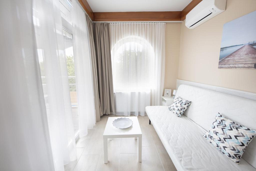 Posteľ alebo postele v izbe v ubytovaní TópART Apartman I