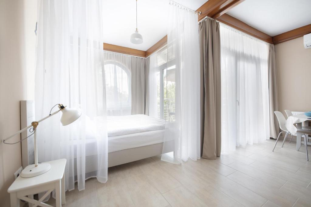 Posteľ alebo postele v izbe v ubytovaní TópART Apartman I