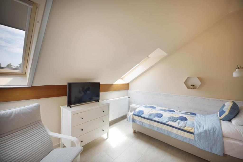 Posteľ alebo postele v izbe v ubytovaní TópART Apartman I