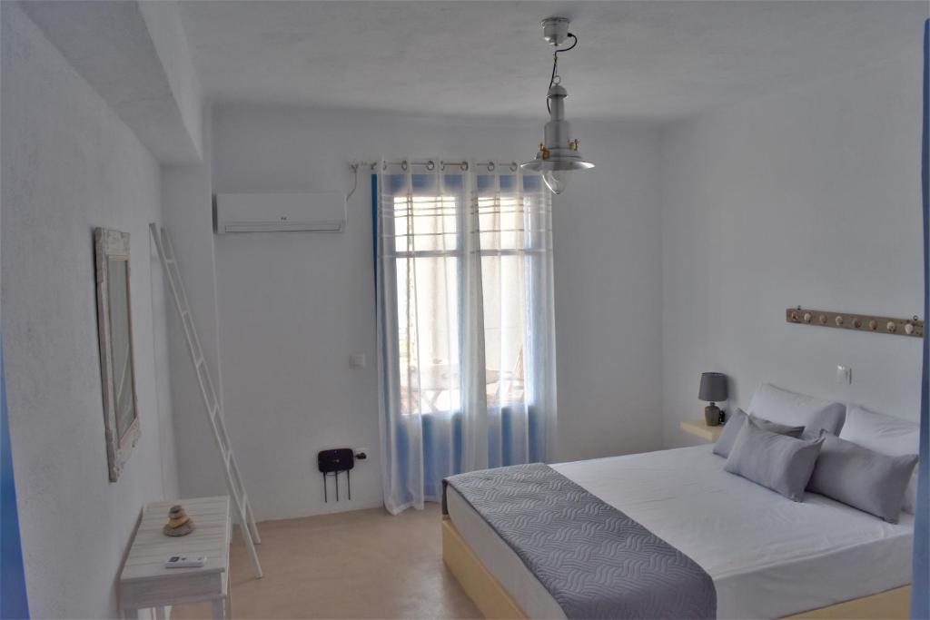 Postel nebo postele na pokoji v ubytování Arsinoi Apartments