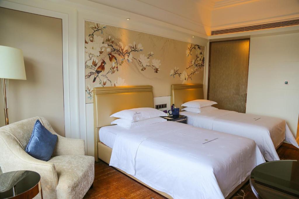 Postel nebo postele na pokoji v ubytování Shenzhen Dayhello international Hotel (Baoan)