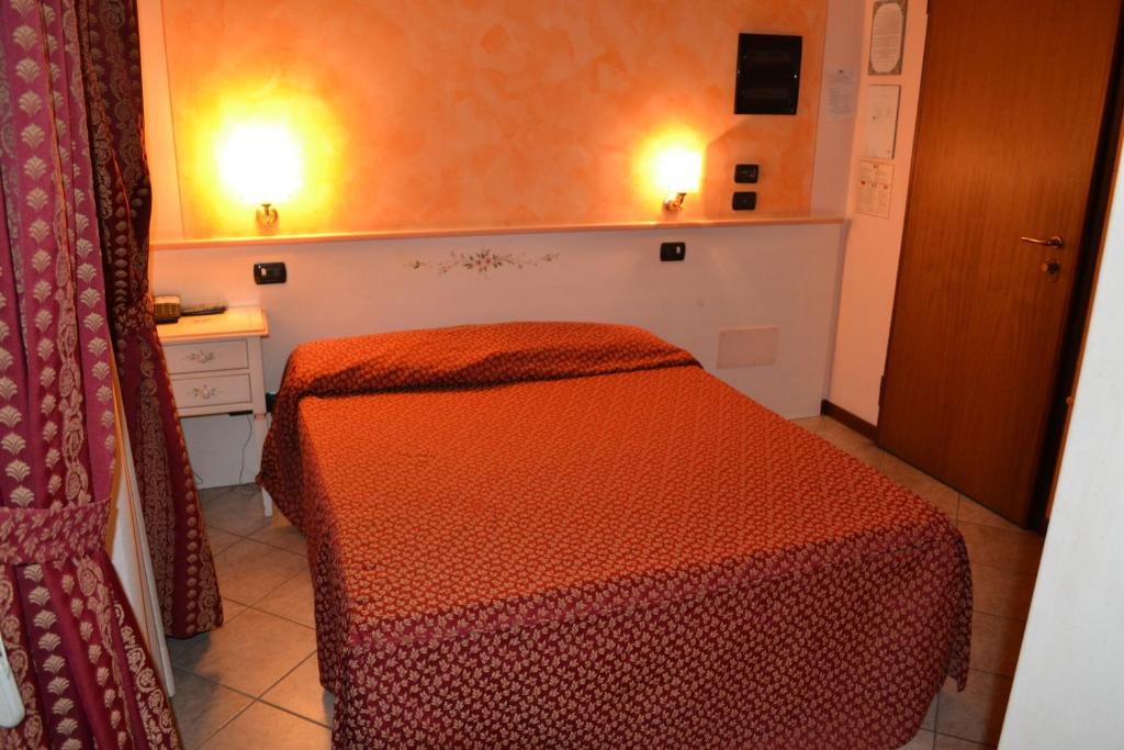 Postel nebo postele na pokoji v ubytování Albergo La Piana